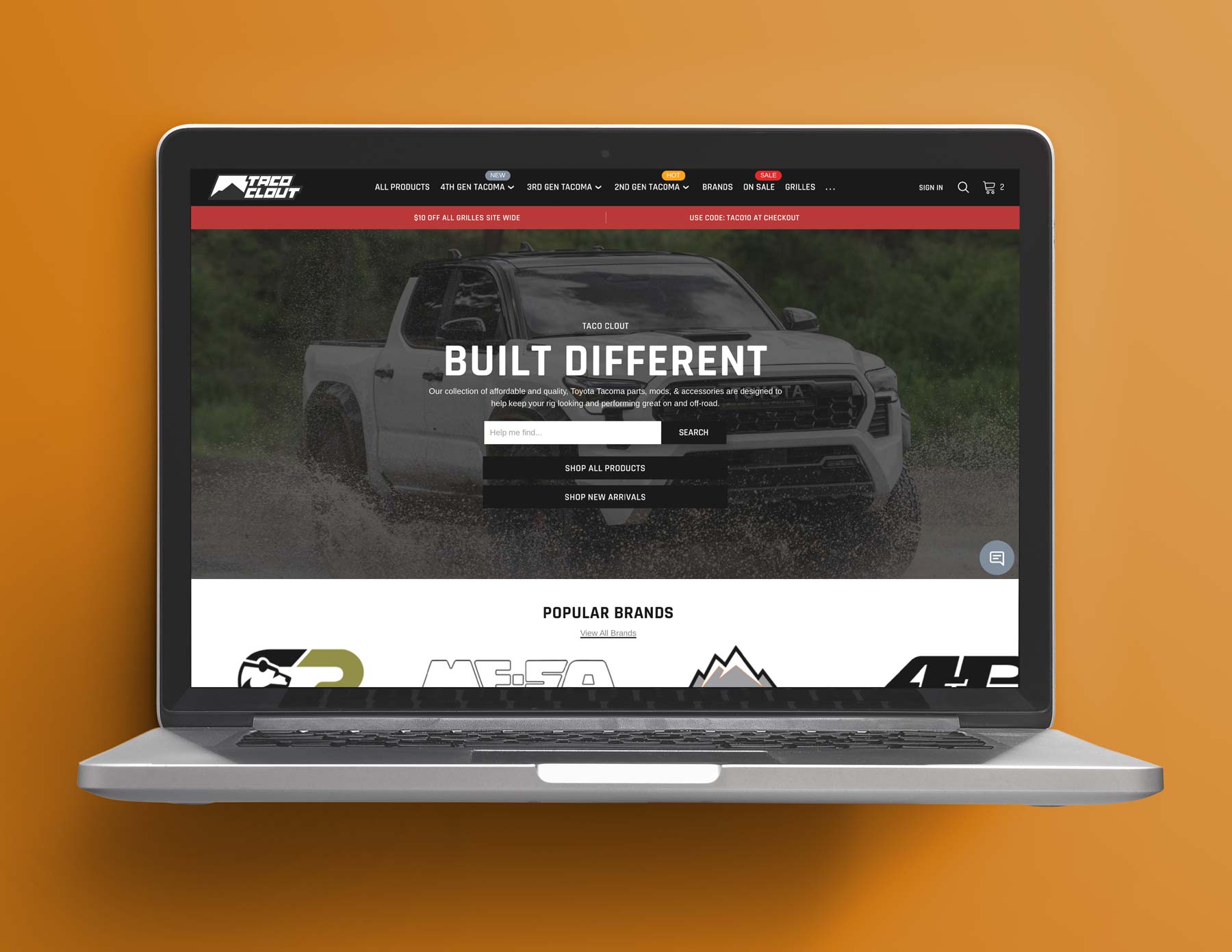 laptop screen showing Taco Clout's homepage with an orange background